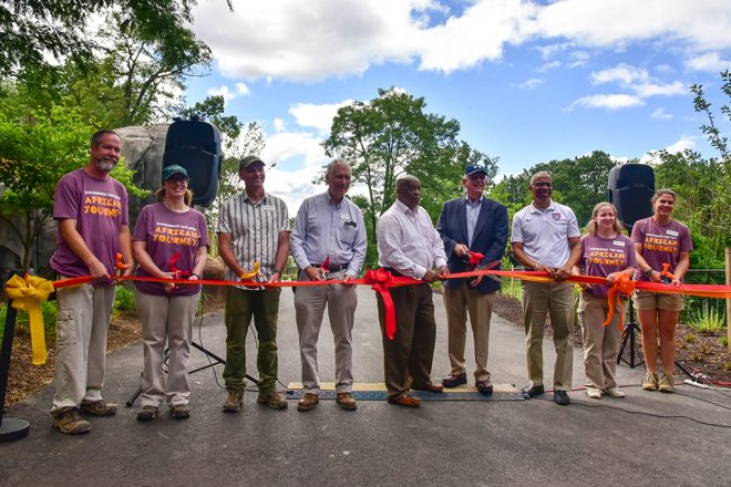 People cutting ribbon